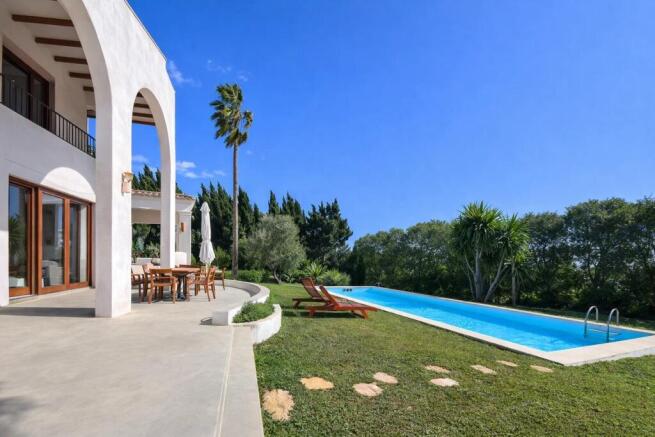 Sunlit pool and garden