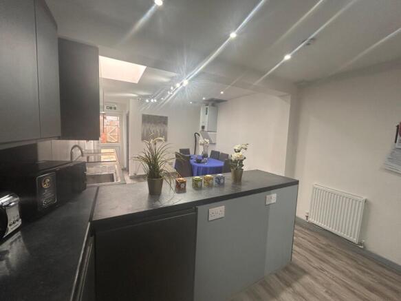 Modern kitchen with island and dining area...