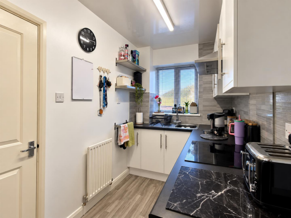 Modern Galley Kitchen with Organised Details.png