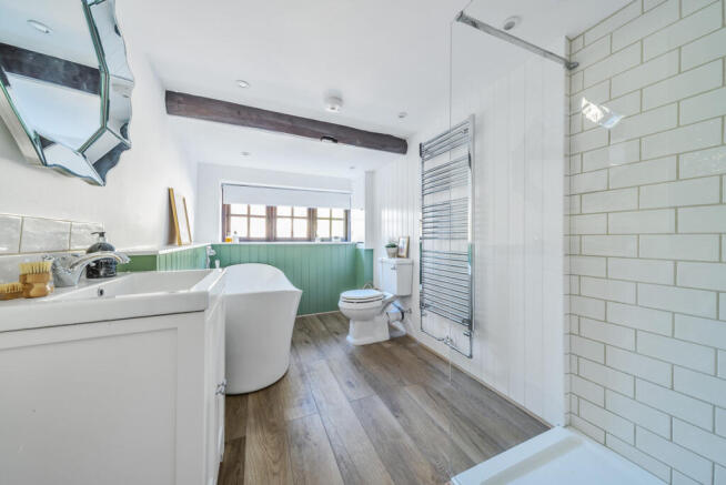 Upstairs bathroom with stand alone bath and large walk in shower