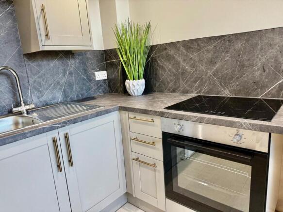 Modern kitchen with sleek marble splashback...
