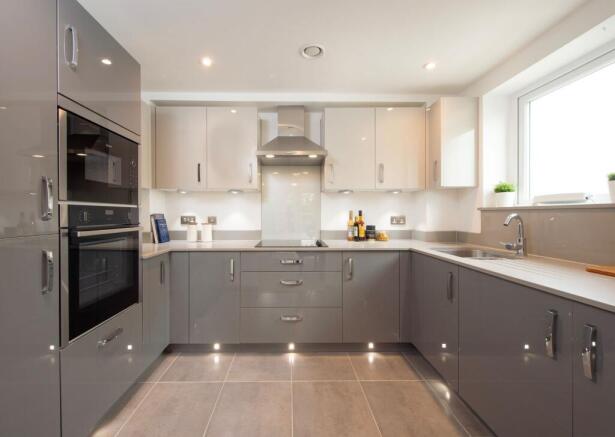 a kitchen with white cabinets