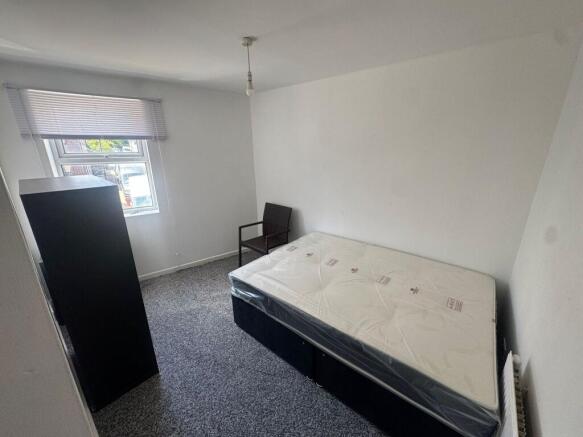 Bright double bedroom with modern grey carpet...