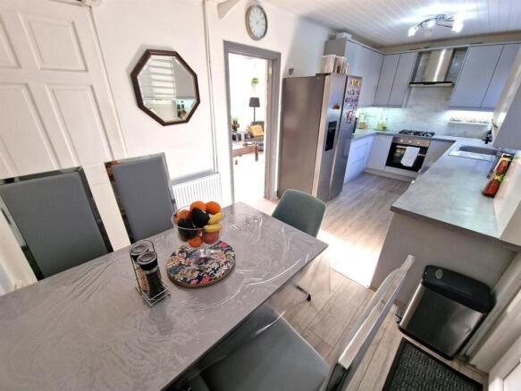 Bright and modern kitchen with sleek cabinetry,...