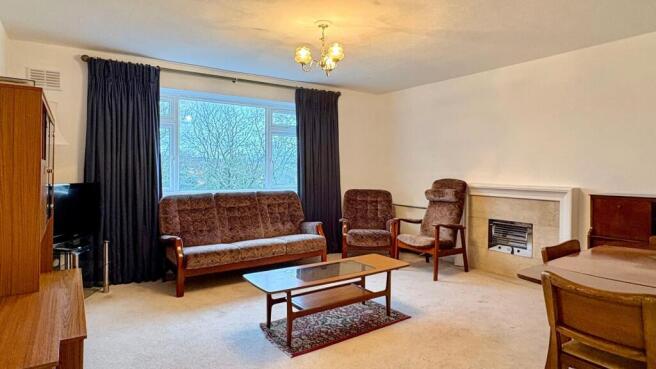 Bright, well-proportioned living room with a la...