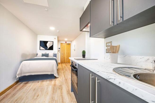 Bedroom, kitchen & living area