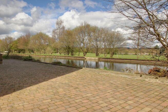 seating area, canal and field views