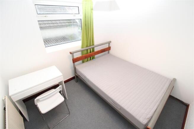 Bright bedroom with double bed and study desk...