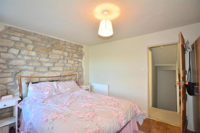 The master bedroom with exposed stone work