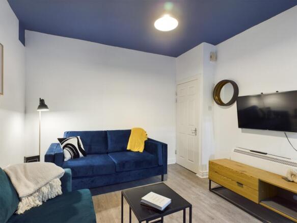 A spacious and stylish modern living room, perf...