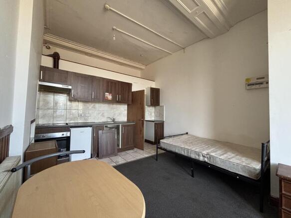 Spacious studio room with fitted kitchenette...