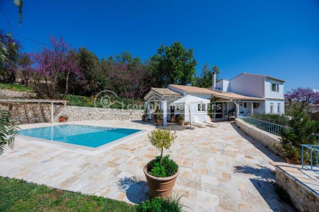 Pool terrace and house