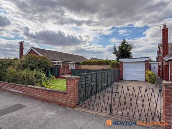 Garage & Driveway To Rear