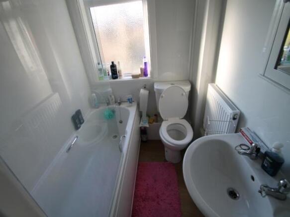 A clean and well-maintained bathroom with a lar...