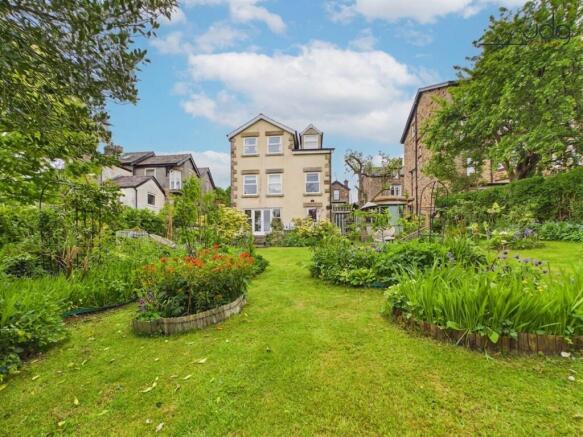 Mature landscaped garden with vegetable and fruit area