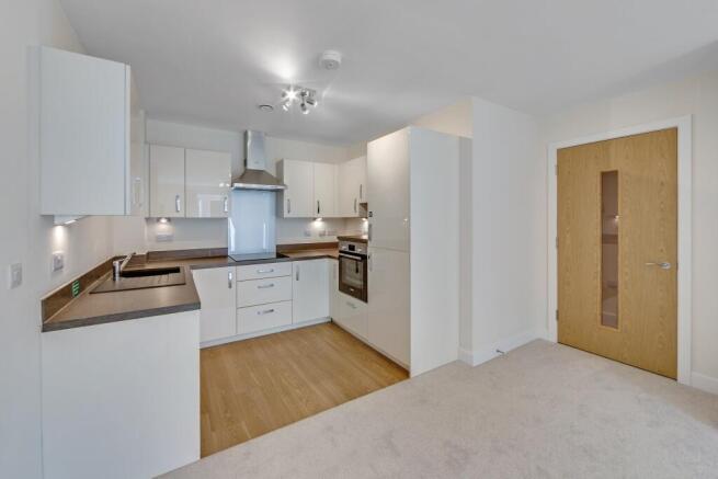 a kitchen with white cabinets