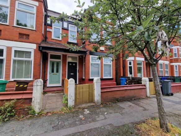 Charming red brick terraced house exterior...