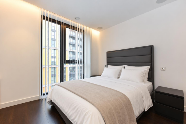 Tidy Bedroom with Crisp White Bedding.png