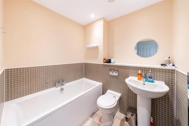 Elegant bathroom with a large bathtub and tiles...