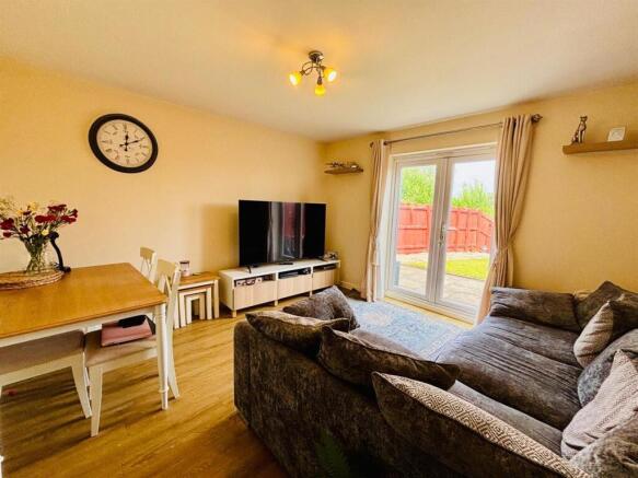 Living Room & Dining Area: