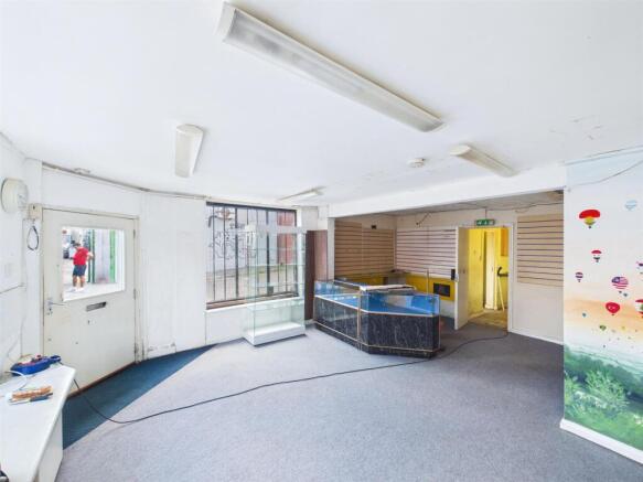 2 - Vacant shop, one-bedroom flat & rear workshop.