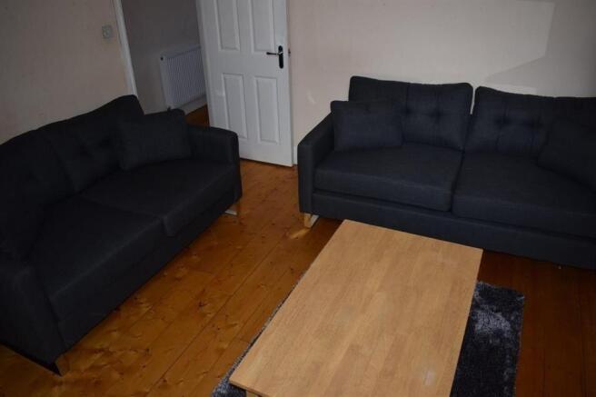 Bright, modern living room with two matching so...