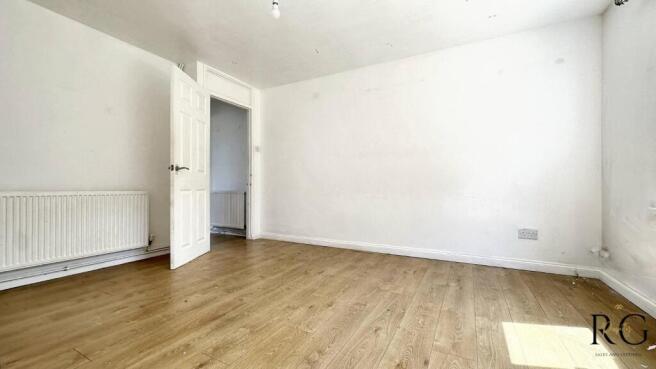 Bright bedroom with stylish wooden flooring...