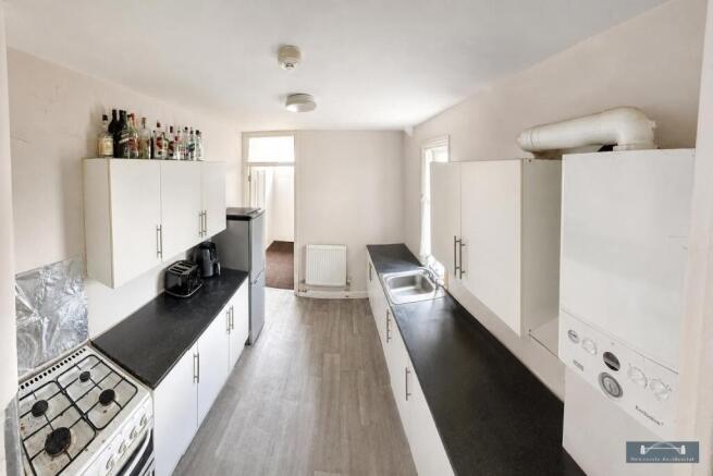 Bright and functional kitchen with ample storag...