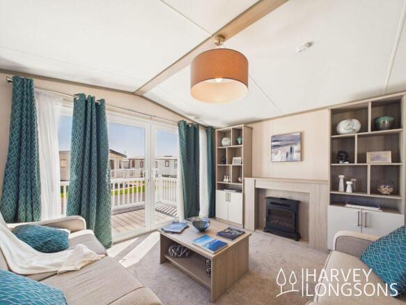 Regal Charmouth lounge with patio doors and deckin