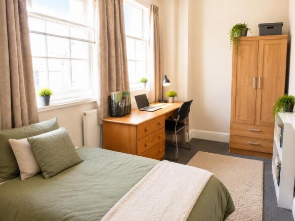 Bright, spacious room with large desk and stora...
