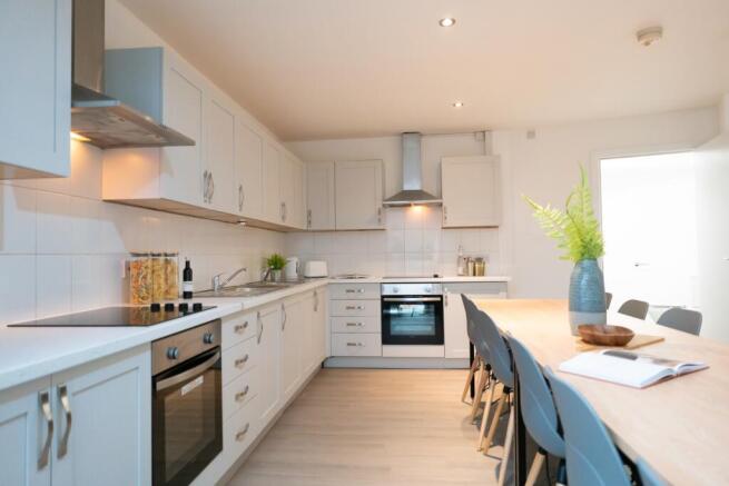 A bright and spacious kitchen featuring modern ...