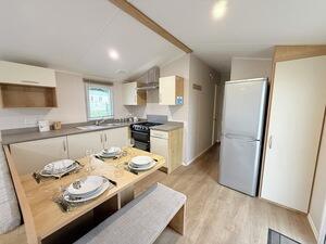 Fully Equipped Kitchen With Dining Table And Bench