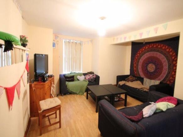 A cozy and inviting living room featuring comfo...