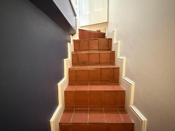 Steps to the tanked cellar