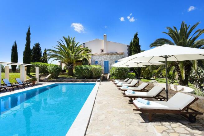 Inviting pool area with sun loungers