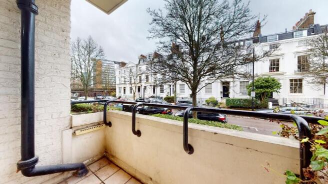 Private balcony with pleasant street views...