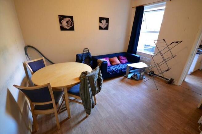 Cosy living area with sofa and dining space...