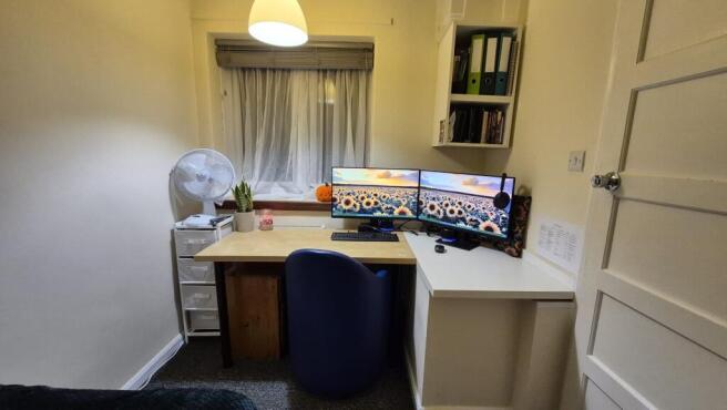 Neat, well-organised study nook with a dual-mon...