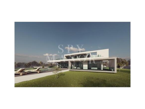 Modern luxury villa for sale in Carvoeiro, Algarve. Showing contemporary white architecture, floor-to-ceiling glazing, outdoor living spaces, pool deck, and landscaped gardens.