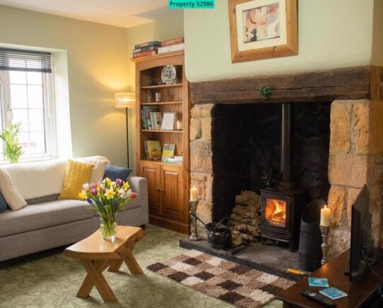 Lounge with inglenook fireplace - front aspect