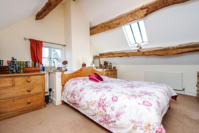 Master bedroom with exposed beams