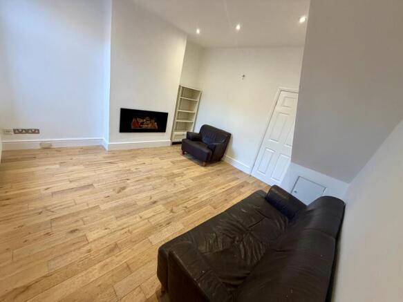 Bright, modern living room with wood flooring, ...