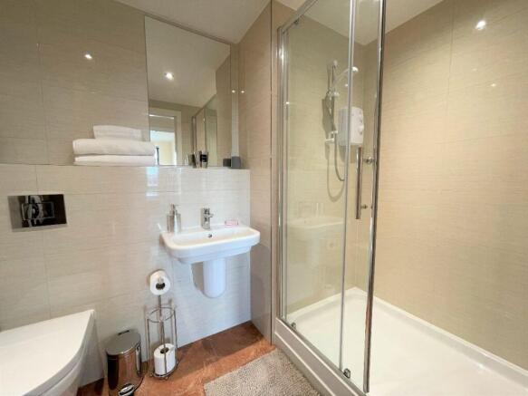 A modern and well-maintained bathroom suite fea...