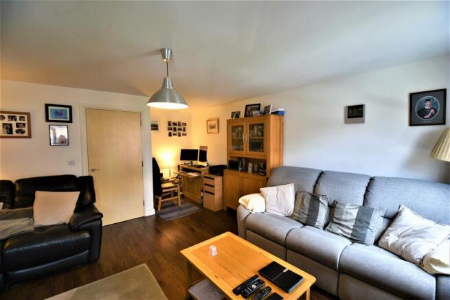 Lounge with dining area in view.JPG