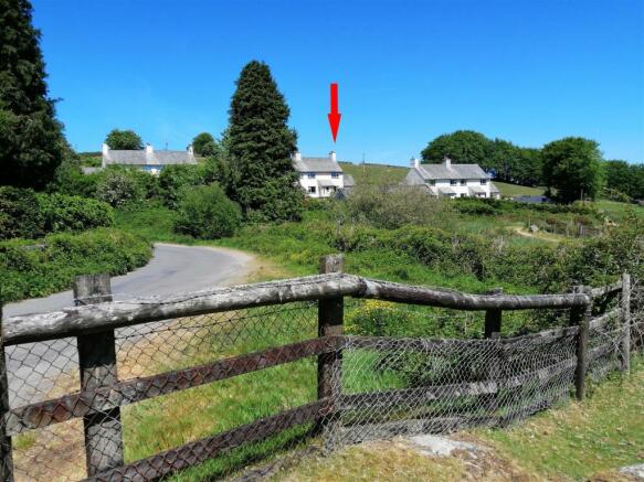 House from Fence with Arrow