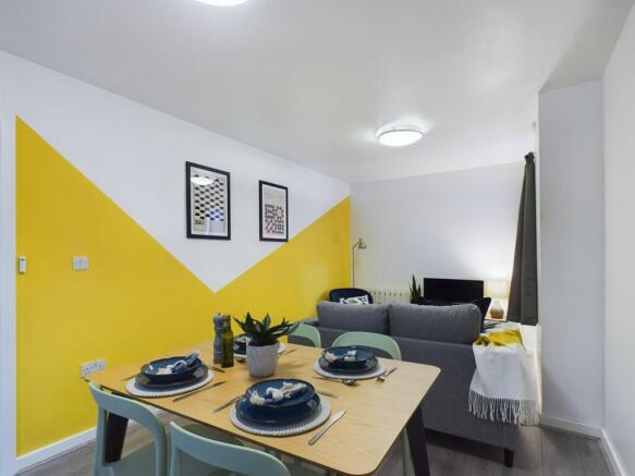 Bright, modern open-plan living area with a sty...