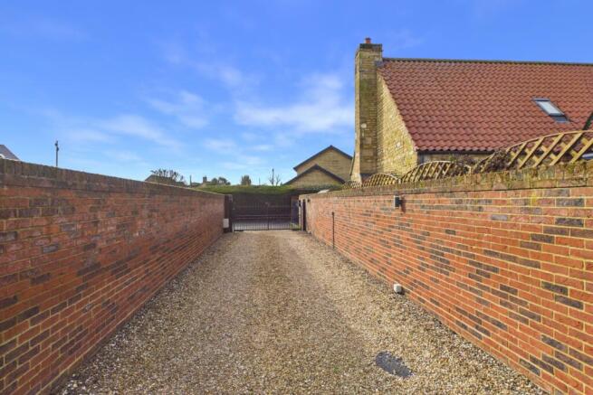 Gated entrance and private driveway