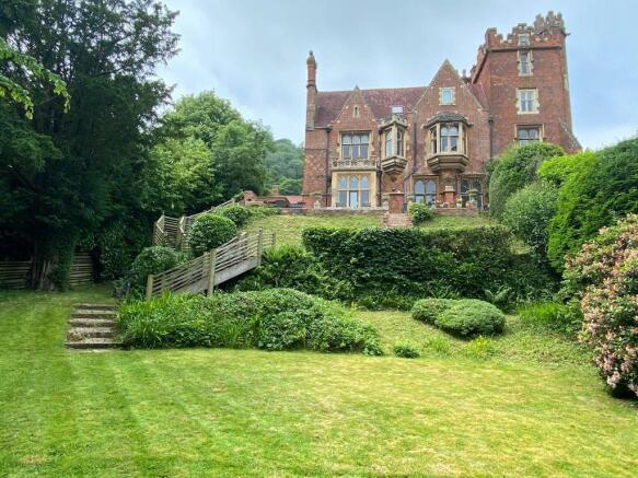Superb rear view of the house & garden
