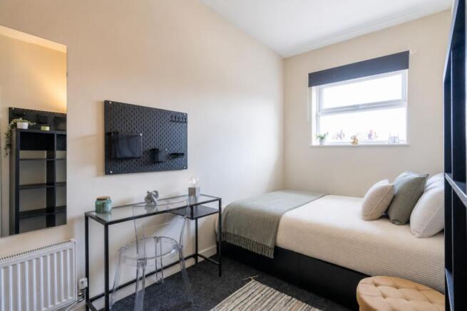 Bright modern bedroom with dedicated study desk...