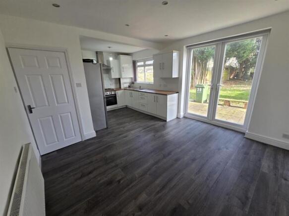 Bright modern kitchen with large garden doors...